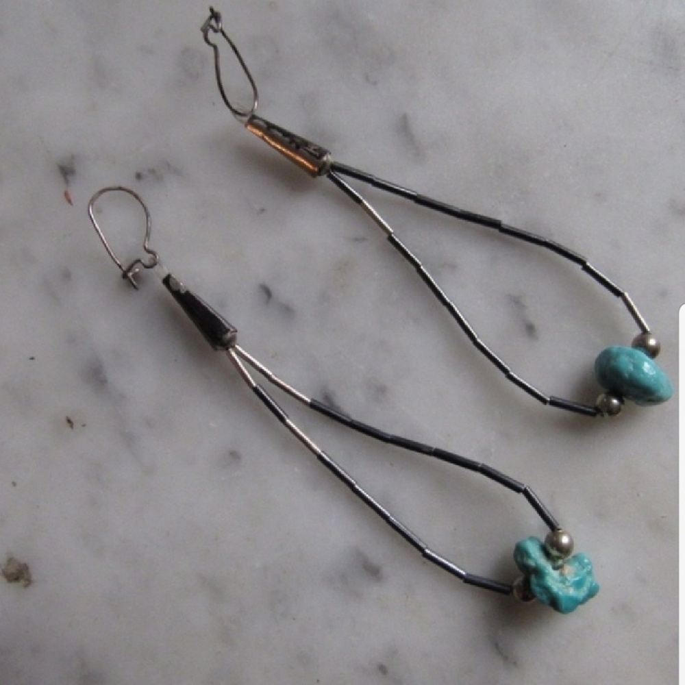 Antique sterling silver with genuine turquoise.